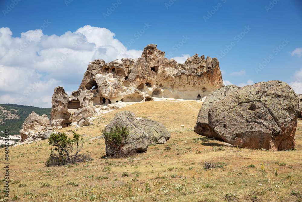 Historical ancient Frig (Phrygia, Gordion) Valley. Tomb (shrine, turbe) and old cemetery. Frig Valley is popular tourist attraction in the Yazilikaya, Afyon - Turkey. Historical ancient Frig (Phrygia, Gordion) Valley. Tomb (shrine, turbe) and old cemetery. Frig Valley is popular tourist attraction in the Yazilikaya, Afyon - Turkey.