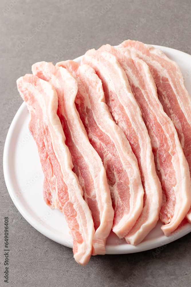 Raw pork belly on a plate