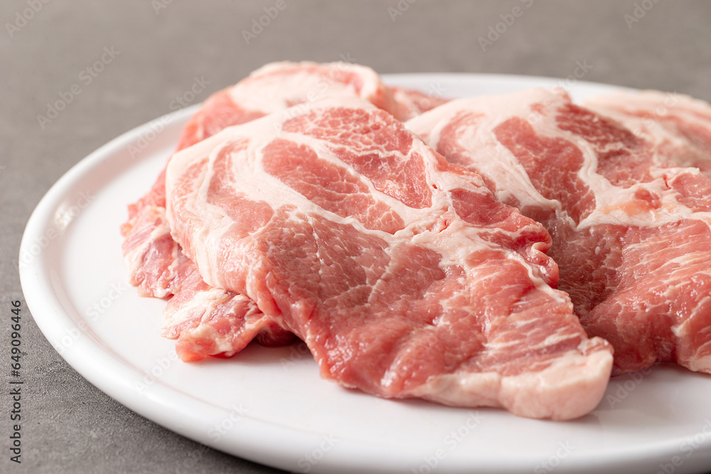 fresh pork neck on plate