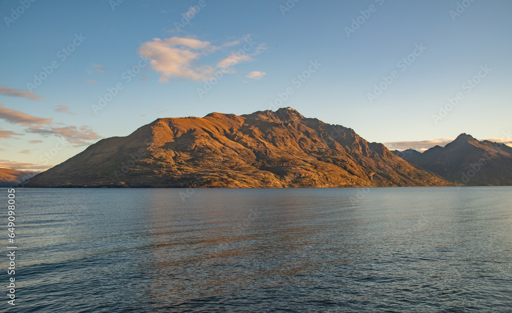 The scenery view of Cecil peak (1,974 metres) at sunset seen from Queenstown the home to ultimate adventure activities in south island of New Zealand.