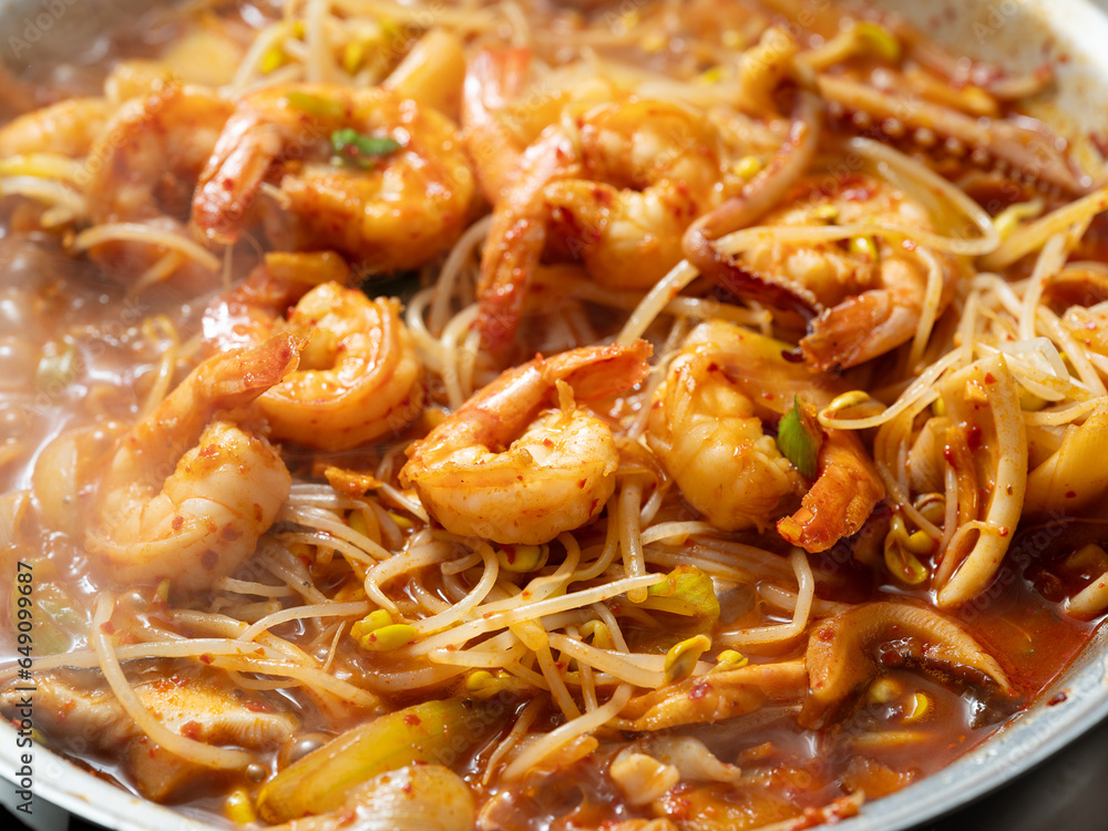 Steamed squid and shrimp mixed with vegetables and spicy sauce Steamed squid and shrimp mixed with vegetables and spicy sauce