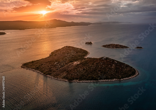 Galesnjak, Croatia - Aerial view of the beautiful heart-shaped island Galesnjak with a colorful dramatic summer sunset above the Adriatic mediterranean sea at the Dalmatia region