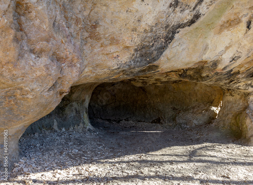 Konstfotografi Mountainous terrain, rocks and stone labyrinths passing into caves and grottoes