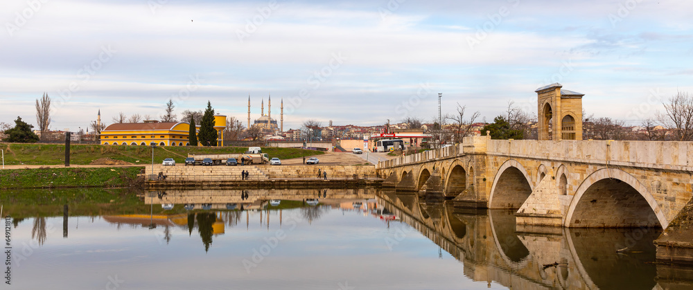 EDIRNE, TURKEY, DECEMBER 22, 2021:Tunca bridge over Tunca river and Selimiye Mosque in Edirne