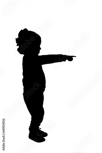 side view of a silhouette  baby boy looking and pointig on white background