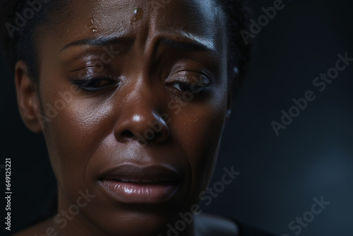 Dramatic Portrait of Beautiful middle-aged african american woman shedding tear © alisaaa