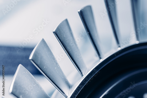 Macro steel blades of turbine propeller blue color with sunlight
