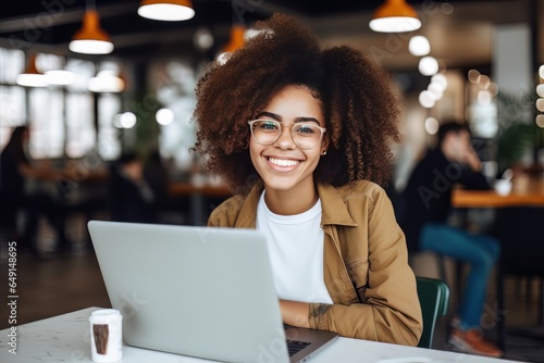 Portrait of Beautiful Black Female Student Learning Online in Coffee Shop, Young African American Woman Studies with Laptop in Cafe, Doing Homework