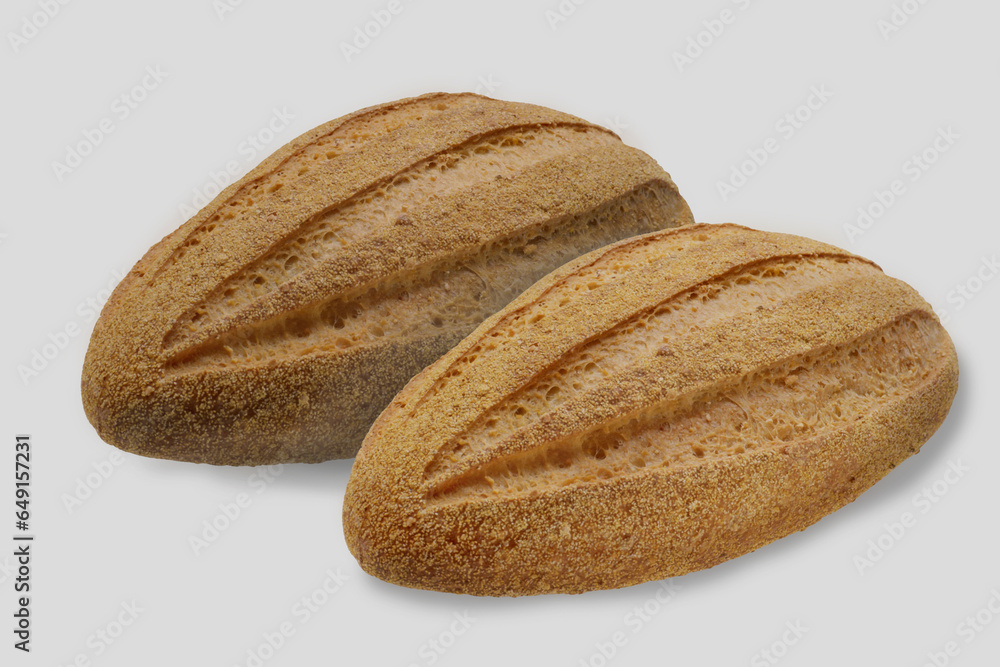 Oval longitudinal rye bread with longitudinal stripes. Isolated image on a white background. Nobody. Oval longitudinal rye bread with longitudinal stripes. Isolated image on a white background. Nobody.