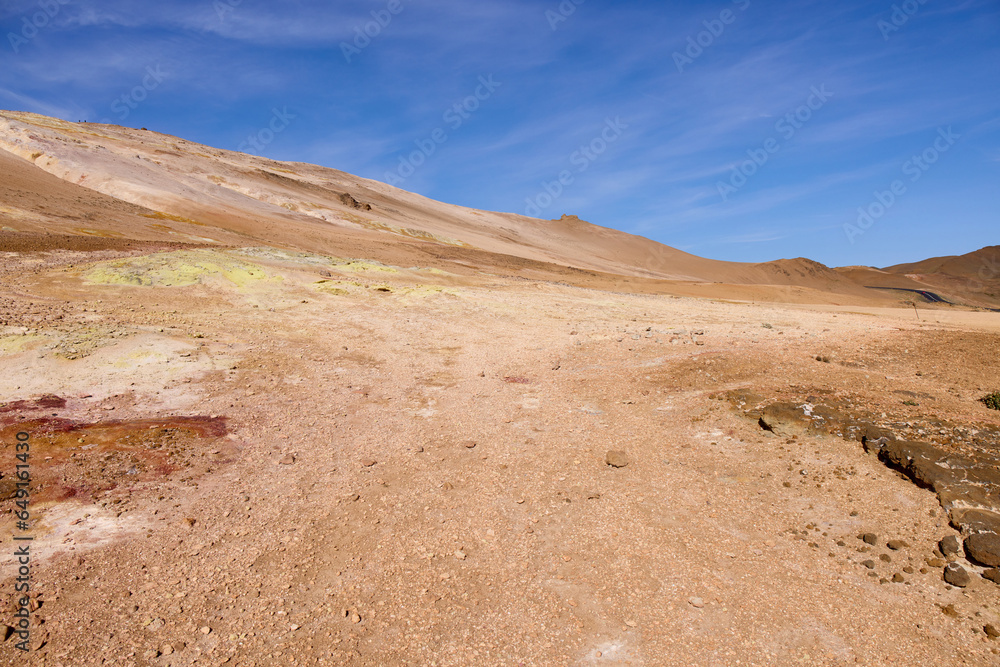 Hverir, Iceland. A surreal, bare orangy-red, geothermal area at the foot of Namafjall. Full of fumaroles, mud pools, steam vents. It's on Route 1. It is also called Namaskard Hverir. Hverir, Iceland. A surreal, bare orangy-red, geothermal area at the foot of Namafjall. Full of fumaroles, mud pools, steam vents. It's on Route 1. It is also called Namaskard Hverir.