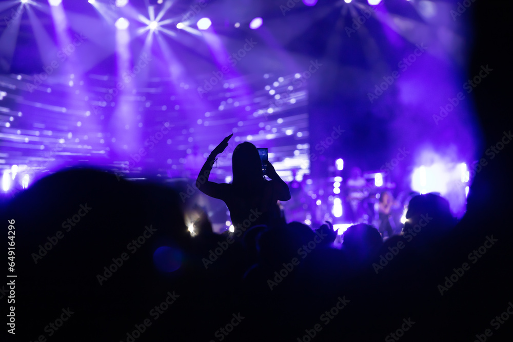 Abstract photo of crowd at concert and blurred stage lights. Abstract photo of crowd at concert and blurred stage lights.