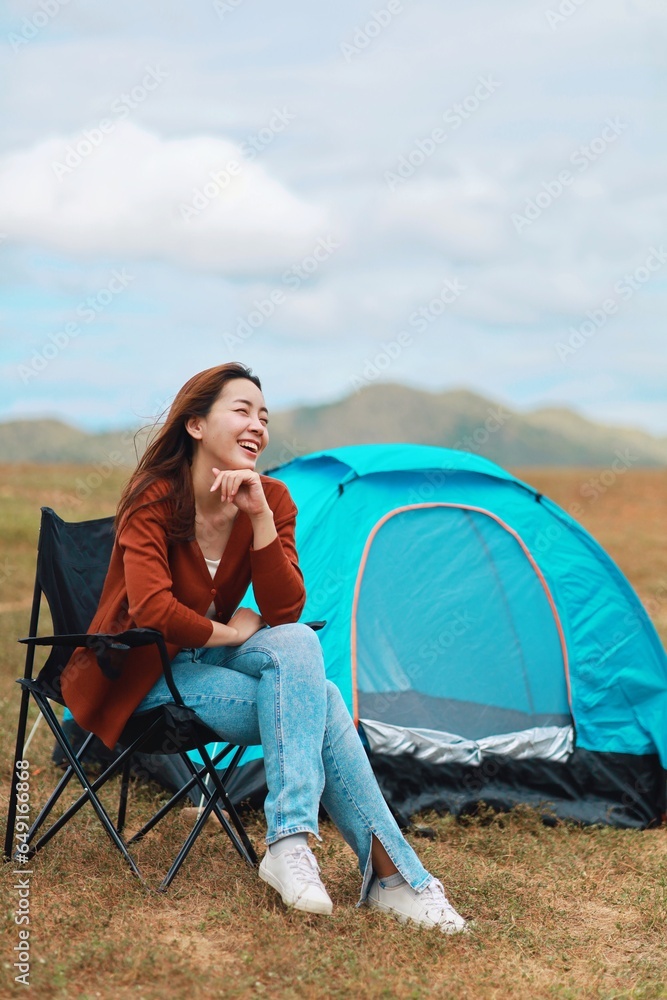 woman sitting on a tent