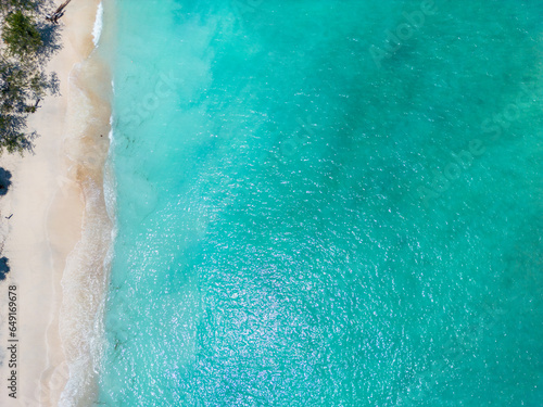 Tropical sandy beach with turquoise ocean drone aerial view, one of the Gili islands in Lombok, Indonesia