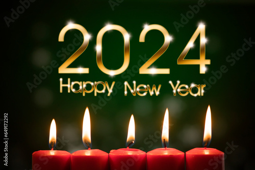 Close up of five burning candles with numbers 2024 new year celebration