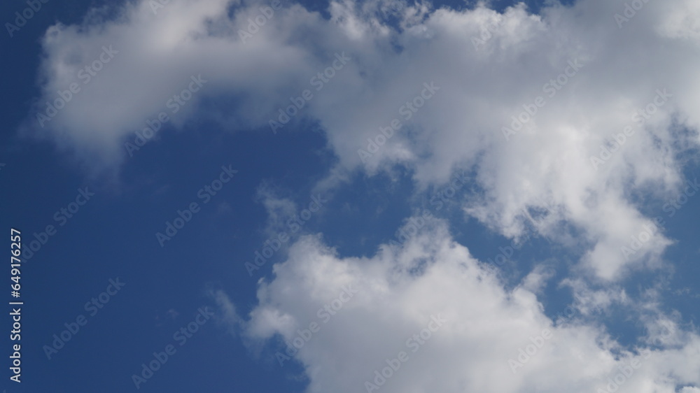 White clouds on a blue sky as a texture, pattern, background