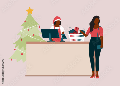 Black Woman Customer With Basket Filled With Christmas Present Standing At Checkout Counter Being Served By A Lady Cashier With Santa Hat And Apron. Full Length. Flat Design.