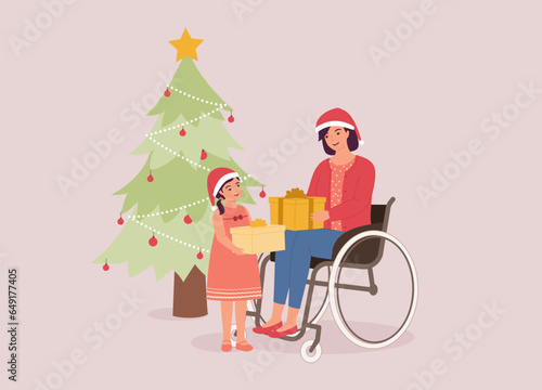 Smiling Disabled Mother With Wheelchair And Little Daughter With Santa Hat Giving Each Other A Christmas Presents. Full Length.
