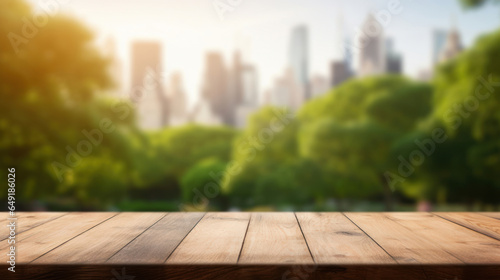 Empty wooden table top with blur background of park and city