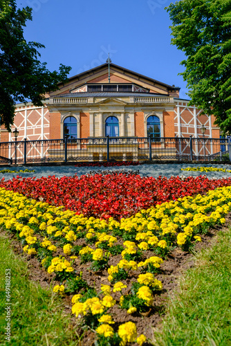 Germany, Bavaria, Bayreuth, Red and yellow flowers blooming in garden ofBayreuth Festival Theatre