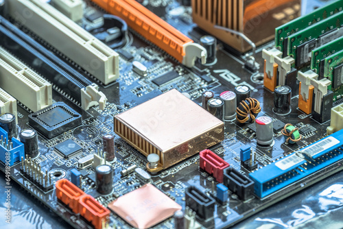 Close-up of computer mother board with radiator in center photo