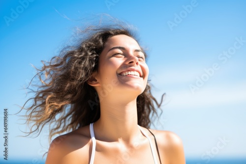 Happy girl against the sky