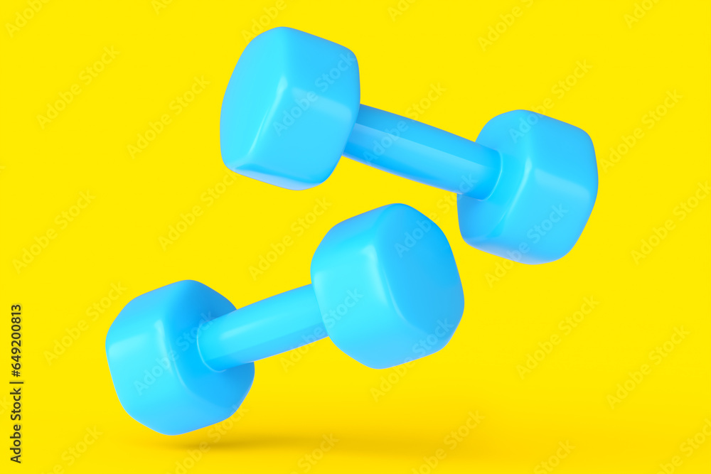 Pair of rubber blue dumbbells isolated on yellow background Pair of rubber blue dumbbells isolated on yellow background