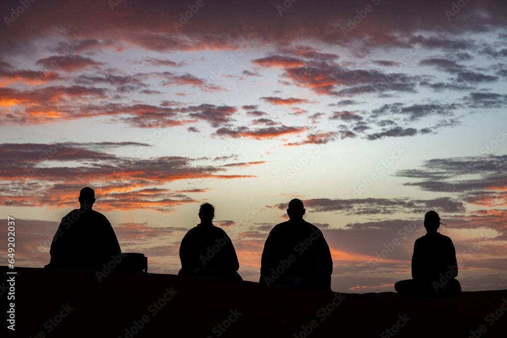 Zen sesshin (retreat) in the Sahara desert, Morocco. Zazen (meditation) at dawn. Zen sesshin (retreat) in the Sahara desert, Morocco. Zazen (meditation) at dawn.