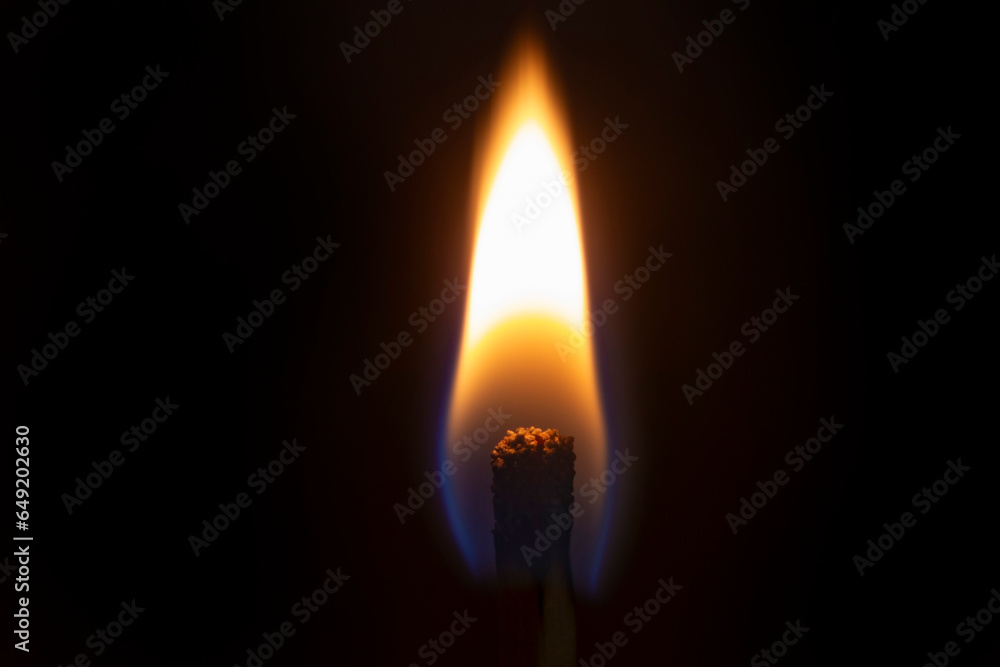 close up of firing safety match against black close up of firing safety match against black