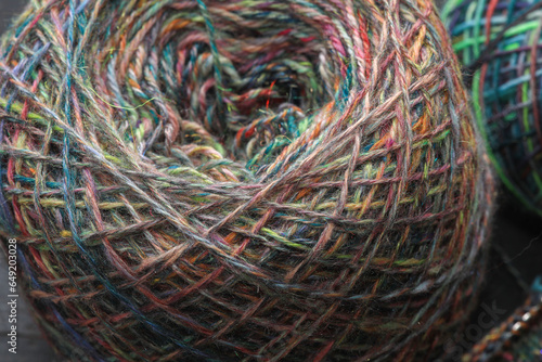 Closeup of  handspun ball of sheep wool yarn, spun on a traditional spinning wheel as a craft hobby photo