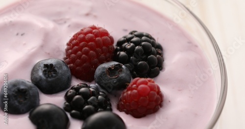 Yogurt with blueberries, blackberries and raspberries Close-up. Healthly food.