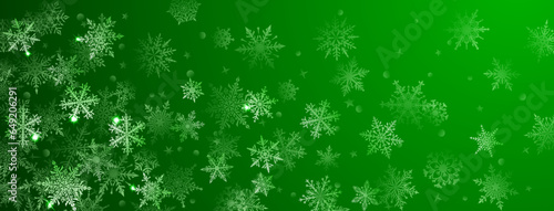 Christmas background of beautiful complex big and small snowflakes in green colors. Winter illustration with falling snow