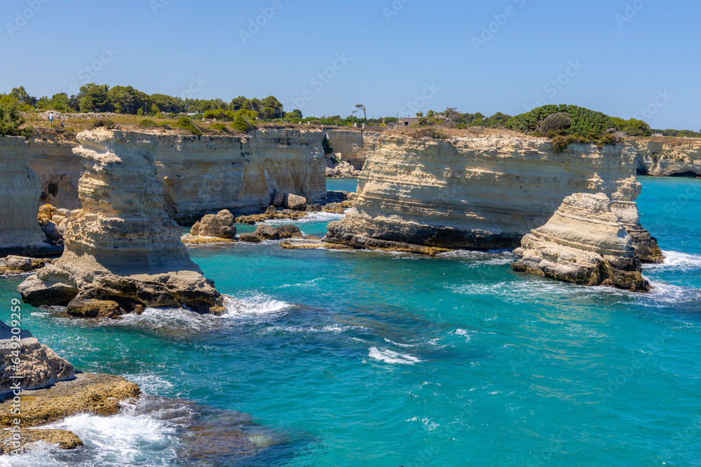 MELENDUGNO, ITALY, JULY 13, 2022 - The cliffs and stacks of Sant'Andrea in Melendugno, region of Salento, province of Lecce, Puglia, Italy