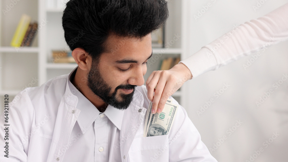 Corruption in medicine, an Indian doctor is happy to take a bribe. The
