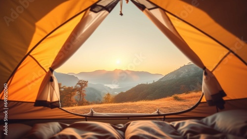 Camping tent with view of mountain range at sunset. Camping concept