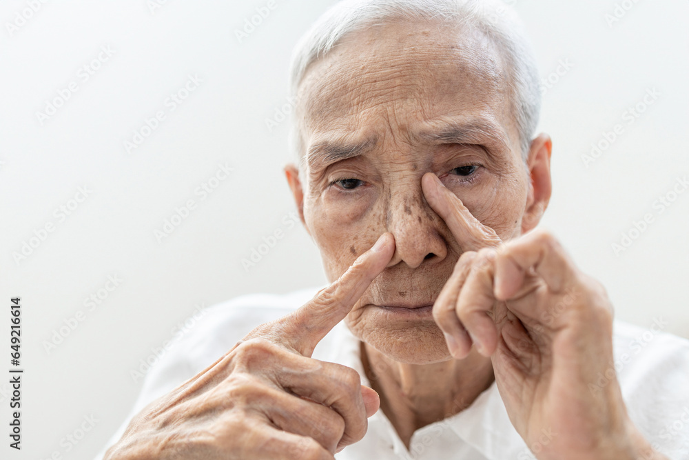Old elderly suffering Chronic Rhinosinusitis with Nasal Polyps or Sinusitis,cold or sinus infections,nasal congestion,blockage of nose,difficult to breathe through nostrils and reduced sense of smell - obrazy, fototapety, plakaty 