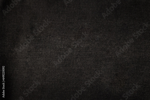 Texture of black denim. Denim background.