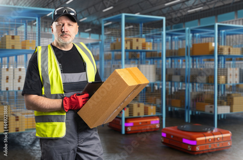 Man works in warehouse. Guy...