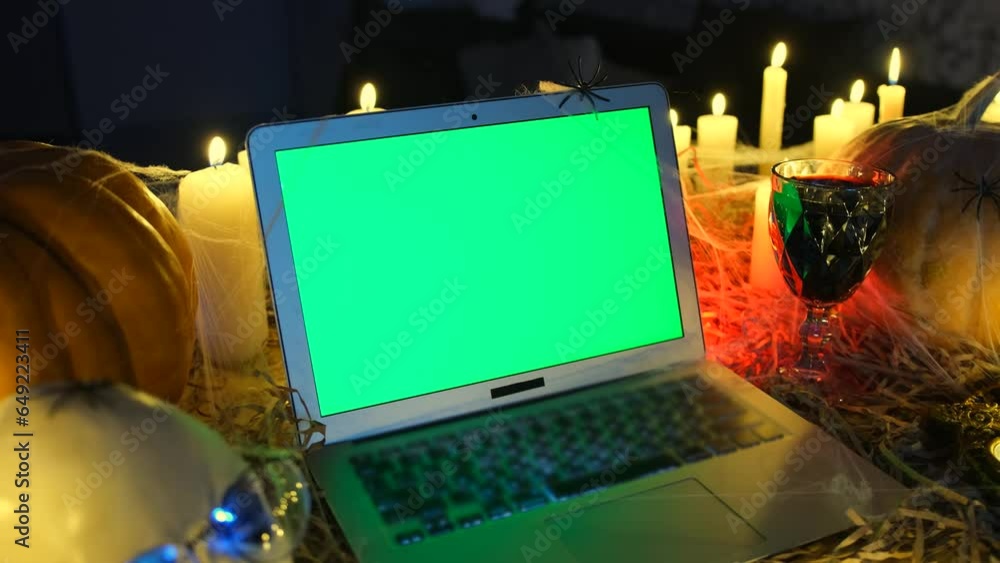 Terribly background Happy Halloween, laptop with green screen and glass ...