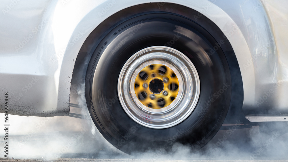 Close up car wheel with smoke on the asphalt road speed track, Car wheel drifting and smoking on track, Car wheel spinning. Close up car wheel with smoke on the asphalt road speed track, Car wheel drifting and smoking on track, Car wheel spinning.