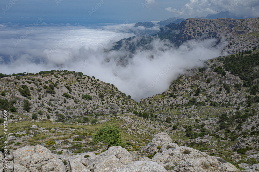 Mallorca, Spain - 11 June, 2023: Views of the Mediterranean sea and Tramuntana Mountains from Puig Caragoli, Mallorca Mallorca, Spain - 11 June, 2023: Views of the Mediterranean sea and Tramuntana Mountains from Puig Caragoli, Mallorca