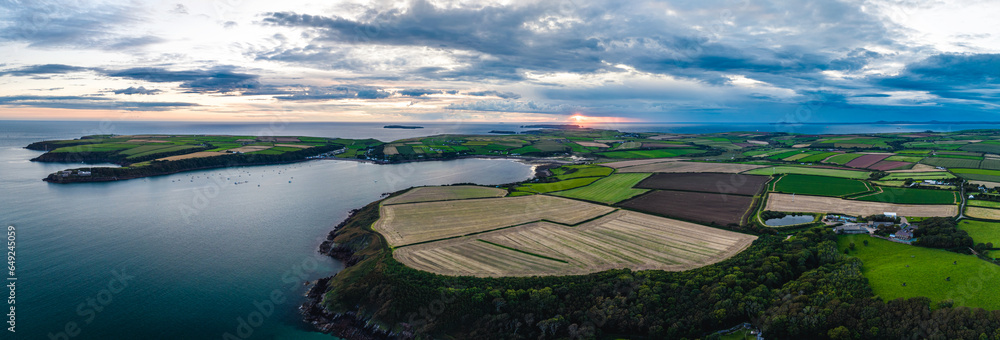 Panorama of Sunset over Fields and Farms from a drone, Monk Haven Beach, Pembrokeshire Coast Path, Haverfordwest, Wales, England