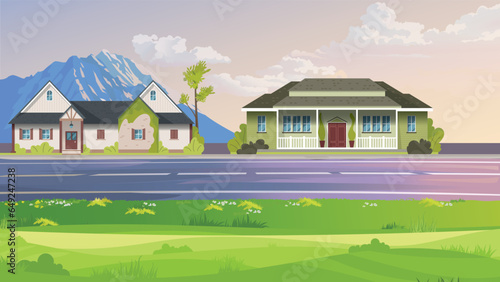 Beautiful mountain village with road and greenery. two house at road side are.  