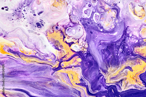 Exclusive beautiful pattern, abstract fluid art background. Flow of blending purple lilac yellow paints mixing together. Blots and streaks of ink texture for print and design