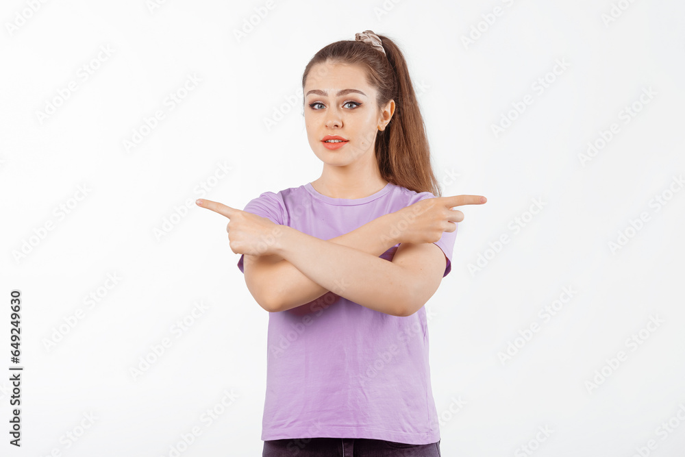 Portrait of young woman with long hair, pointing fingers in different directions with confused face, puzzled what to choose, standing over white background Portrait of young woman with long hair, pointing fingers in different directions with confused face, puzzled what to choose, standing over white background