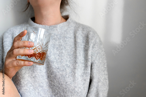 Depressed sad addicted woman feeling bad drinking whiskey alone , stressed frustrated lonely female drinker alcoholic suffer from alcohol addiction having problem, alcoholism concept. photo