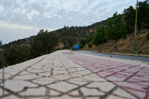 road in the mountains beside an old town