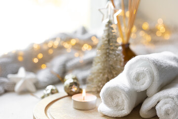 Foto auf Acrylglas Massagesalon Christmas spa composition on a blurred background with bokeh lights.  © puhimec