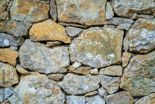 Closeup view of ancient dry stone wall - a natural textured background