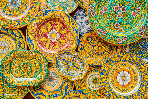 Quadro su tela Background with decorated and colorful porcelain plates