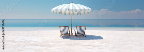 beach chair and umbrella on the white sand